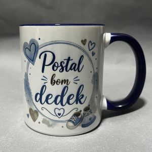 Close-up of a white ceramic mug with a dark blue rim and handle, decorated with blue hearts and cursive text.
