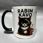 White ceramic mug with black handle, featuring a black cat holding a coffee mug against a gray background.