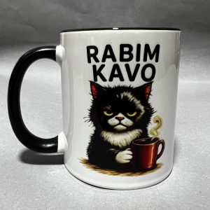 White ceramic mug with black handle, featuring a black cat holding a coffee mug against a gray background.